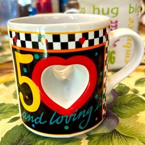 50 and loving it motif ceramic mug . Great gift for turning 50 . Never used